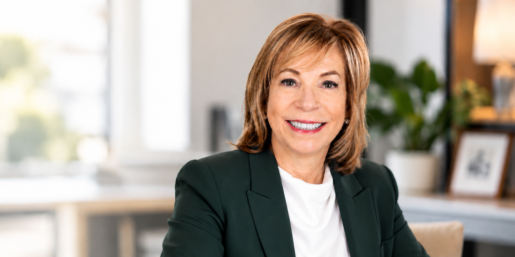 Cynthia Delfino Birdsall, founder of Pivot Impact Partners, seated in a sunlit office